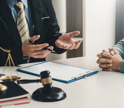 Image lawyer businessman sitting at the office with a woman customer explaining the agreement of advice.